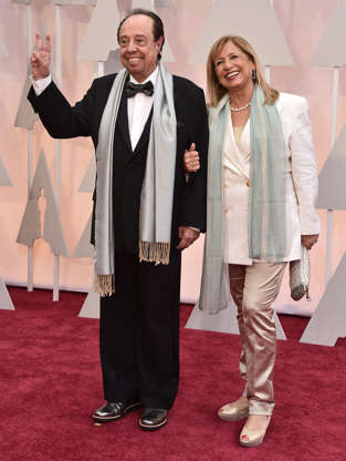 Slide 2 of 3: Film composer Sergio Mendes and his wife, Gracinha Mendes, arrive at the Oscars on Sunday, Feb. 22, 2015, at the Dolby Theatre in Los Angeles.